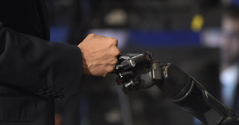 Nathan Copeland brain-controlled robotic arm sense of touch